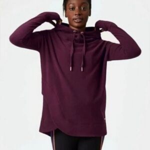 Sweaty Betty burgundy/maroon hoodie, women’s size XS. Rounded hem.